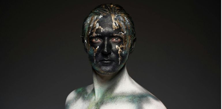 man with face makeup in fantasy style