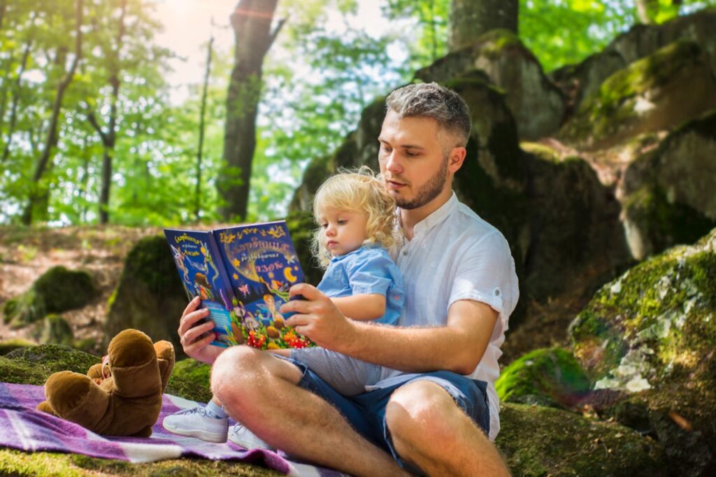 Precious Story Time: Father and Toddler Reading Together Outdoors